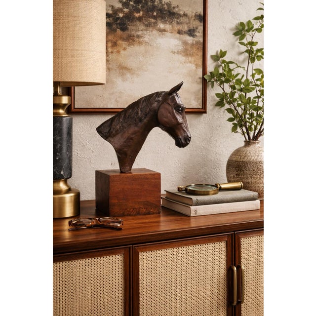 A striking mid-century modern horse head sculpture, expertly rendered with elongated, stylized lines and expressive hand-...