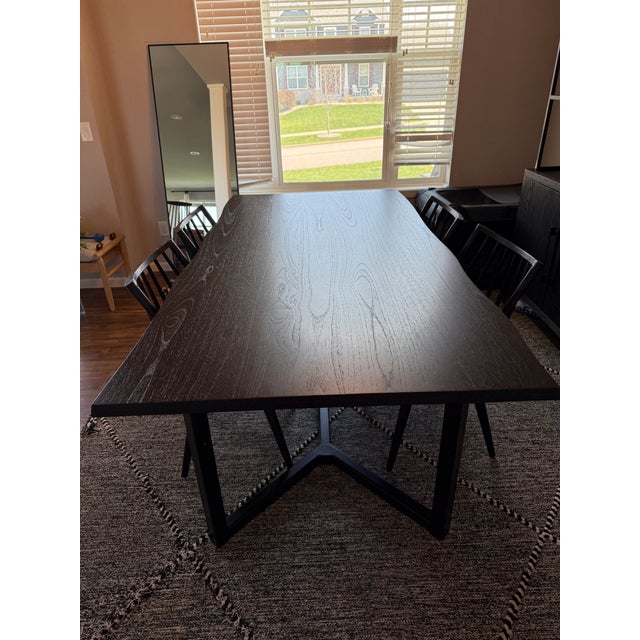 Crate & Barrel dining set including an 80” Verge Black Live Edge dining table and 4 matching black wood spindle-back...