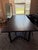Crate & Barrel dining set including an 80” Verge Black Live Edge dining table and 4 matching black wood spindle-back...