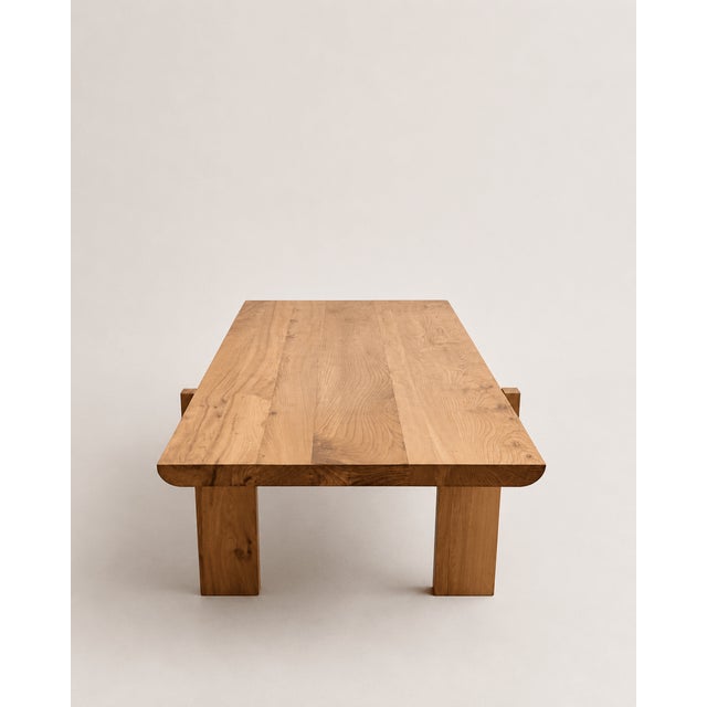 A substantial late twentieth-century dining table attributed to Luigi Gorgoni, constructed in solid elm with a strongly...