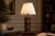 A wonderfully characterful vintage table lamp crafted from a stack of antique leather-bound books with rich gilt spine...