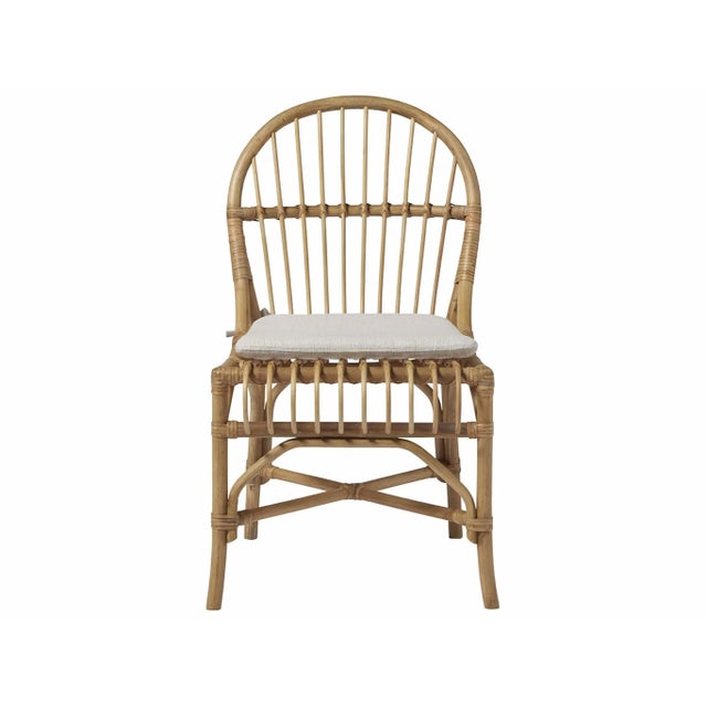 Abundant with intertwined accents, the Sanibel Chair features a warm rattan and bamboo body, and a cozy upholstered seat...