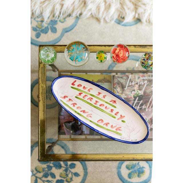 “Love Is A Seriously Strong Drug” – Large Decorative Platter by Tatiana Alida A quote close to Tatiana’s heart, this bold...