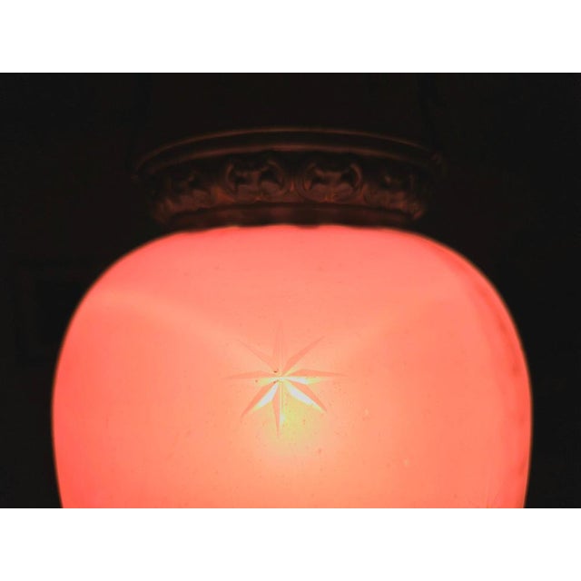 In this listing you will find a striking and extremally decorative Antique Pink Glass Lantern, with brass decorative...