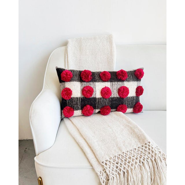 Add some subtle and elegant holiday vides to your home decor This lumbar pillow from Chamula blends rustic charm with...