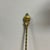 This vintage English brass toasting fork is adorned with a charming "Man in the Moon" motif at the top, showcasing...