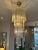 A large clear Murano glass cascading spiral chandelier pendant light by Italian Manufacturers Novaresi. Suspended from a...