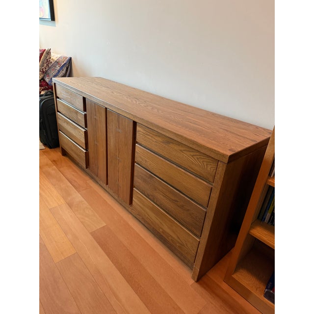 This multi-functional Mid Century Modern piece can serve as a dining room buffet or as a bedroom dresser. It features a...