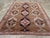 This mid-20th century Turkish Anatolian tribal carpet, measuring 7' 11" x 10' 6", presents a balanced and graphic layout...