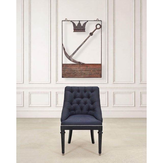 A rare hanging British "Crown and Anchor" pub or tavern sign constructed out of iron and wood. The sign is crafted with a...