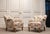 Elegant pair of Swedish lounge chairs dating from the 1940s, displaying a graceful combination of Swedish Grace...