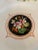 Lovely set of three hand painted cabinet plates with a central floral design on black ground in a central cartouche with...