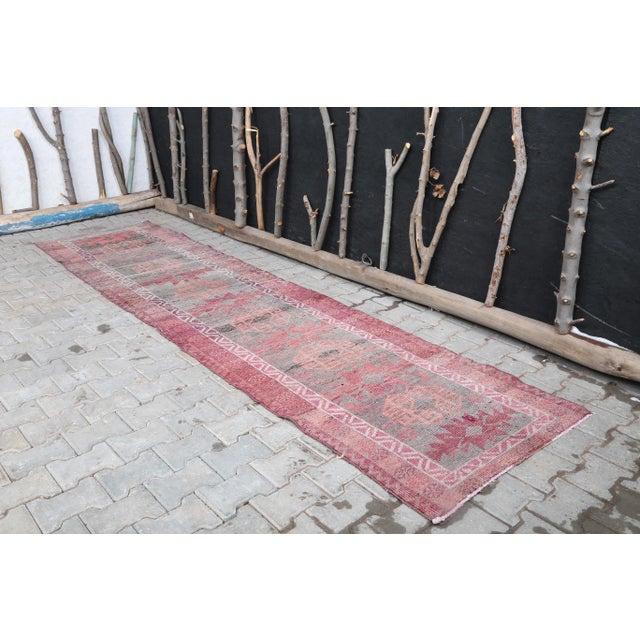 Vintage Turkish Hand-Knotted Hallway Runner Rug is a semi-Vintage rug. '60s Eastern region of Turkey's unique rug is...
