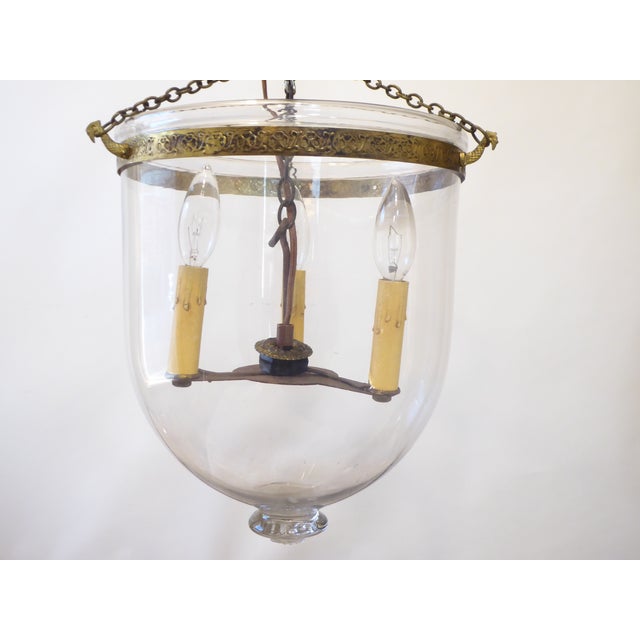 This bell light has updated wiring and uses 3 candelabra base bulbs up to 60 Watts each. It ships disassembled.