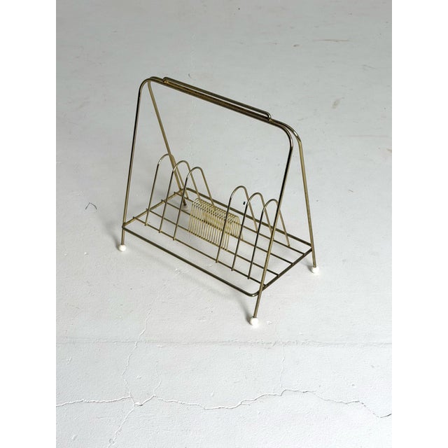 Danish Magazine Rack, Metal Wire, 1960s Elegant and lightweight Danish magazine or record rack from the 1960s. Made from...