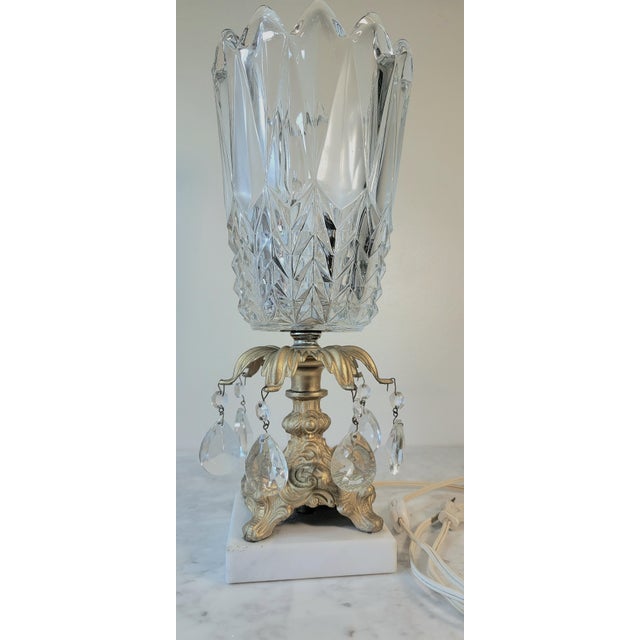 This Stunning Vintage Tulip Hollywood Regency Style Lead Crystal Table Lamp is a perfect piece to add to your collection....