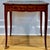 A beautifully restored French Louis XV style writing table with tulipwood and kingwood marquetry, floral inlay, leather...