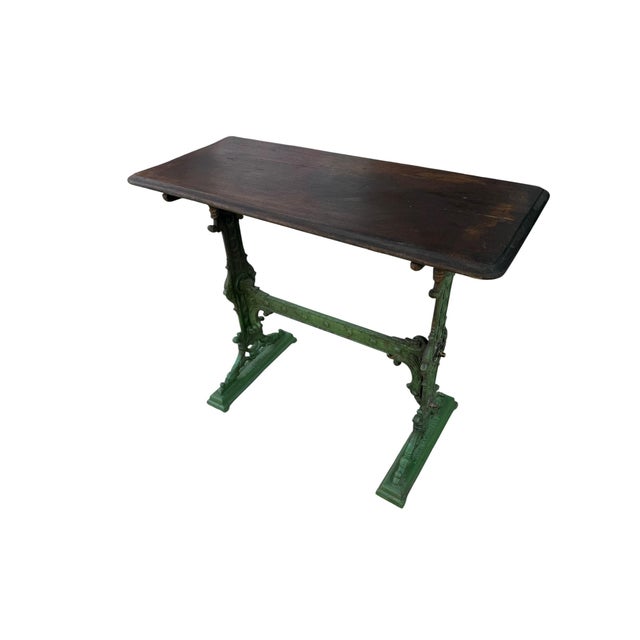 This is an ornate cast iron side table by Gaskell & Chambers, dating from approximately 1900. The table features intricate...