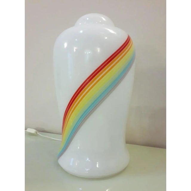 Vintage Italian Murano glass table lamp with frosted white body and a swirl stripe in the colors of rainbow / Made in...