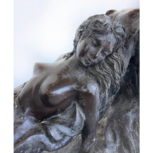 Vintage Sculptural Spelter Nude Coffee Table with Bronze Patina and Glass Top Offered for sale is a vintage sculptural...