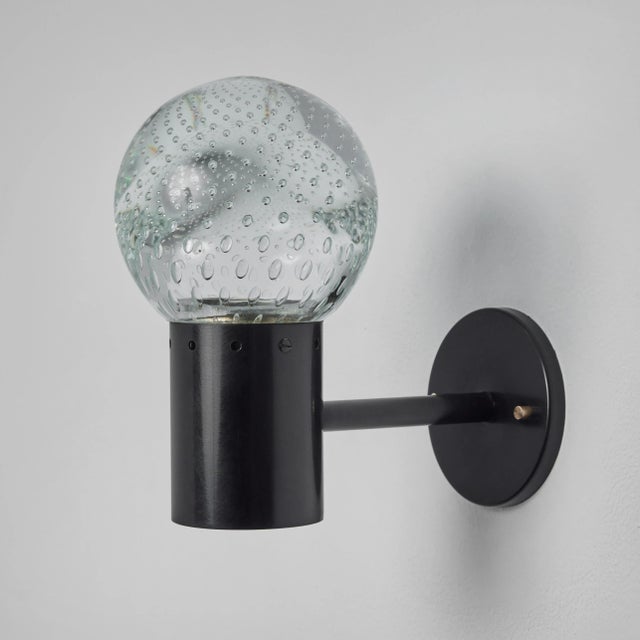 1960s Gino Sarfatti metal and Seguso glass sconce for Arteluce. Executed in hand blown bubbled Seguso glass and painted...