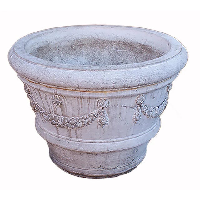 Large traditional style cast stone planter. Interior diameter:34", tapers to bottom diameter:18".