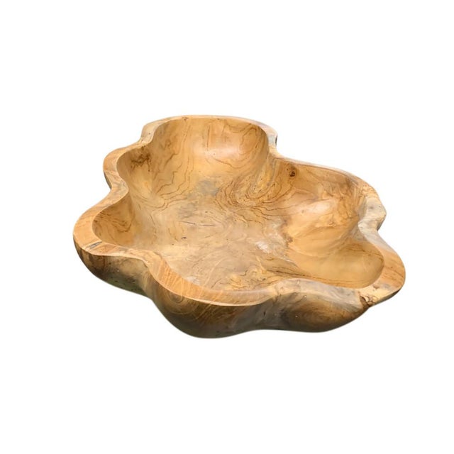 This teak live edge bowl is a unique piece showcasing the natural beauty of teak wood. Crafted by skilled artisans, its...