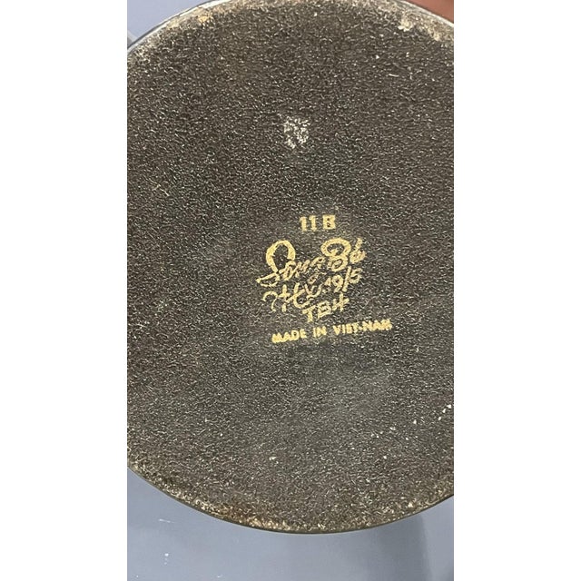 Add elegance to your décor with this pair of black Vietnamese vases. Their sleek, minimalist design and rich black finish...