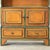An English graduated or waterfall bookcase from the early 20th Century. This piece is built from pine, which has a layered...