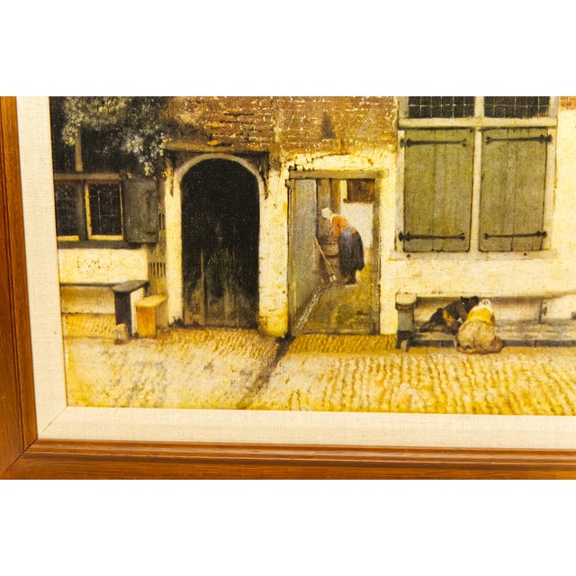 Framed canvas print of Johannes Vermeer’s The Little Street, capturing the timeless charm and quiet beauty of 17th-century...