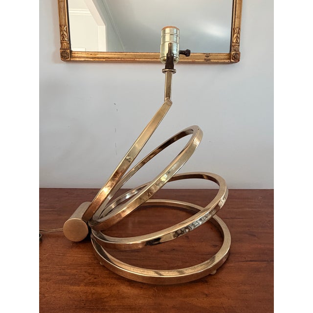 Brass spiral Slinky lamp from the 1970s in very nice condition. I was so happy to find this one of a kind lamp. It's very...