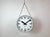 This large double sided railway or factory clock was produced by Simlex in Germany during the 1960s. The piece features a...