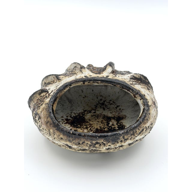 Handcrafted stoneware vase by Henni Keramik, Denmark, dating from the 1970s. Featuring a bold sculptural relief with...