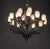 Statement 20-light chandelier featuring sculptural dark wood arms with a brushed nickel frame and hardware, topped with 20...