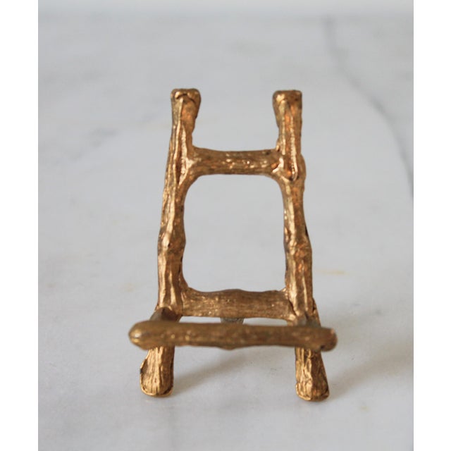 Vintage Miniature Hollywood Regency-style brass faux bamboo tabletop easel featuring a burnished gold finish. No makers...