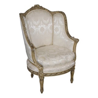 French Louis XVI Creme Painted Tall Back Heavily Carved Bergere Chair For Sale