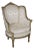 French Louis XVI Creme Painted Tall Back Heavily Carved Bergere Chair For Sale