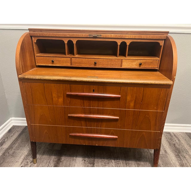 Authentic mid-century modern Swedish teak roll-top desk designed and manufactured by Bröderna Gustafssons Träindustri in...
