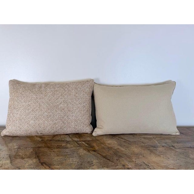 A custom pair of lumber pillows crafted in a natural woven linen featuring a hand blocked geometric lattice motif. The...