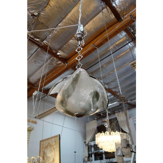 Mid-Century Mazzega Style pendant chandelier, formed by two concave Murano Style glass intersecting shields. Ca 1960...