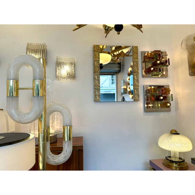 Mid-Century Modern Space Age cast brass sculpture style gilt bronze wall mirror by Luciano Frigerio. Famous design like...