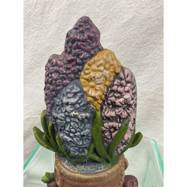 Vintage Colorful floral iron doorstop in barrel -in very good condition. 8 1/2” tall 5” wide 3” deep including under door...