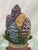 Vintage Colorful floral iron doorstop in barrel -in very good condition. 8 1/2” tall 5” wide 3” deep including under door...