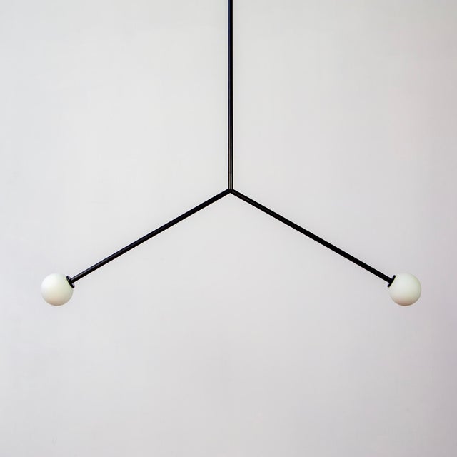 The Y Pendant Light offers a subtle take on modern design. The fixture flies high, soaring above a space with confidence....