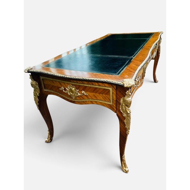 French Louis XV Bureau Plat Desk With Ormolu Mounts, Leather Top & Herringbone Parquetry Veneers A desk so elegant it...