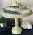 A rare and charming antique wicker table lamp in the style of Heywood-Wakefield, featuring a beautifully woven body and...
