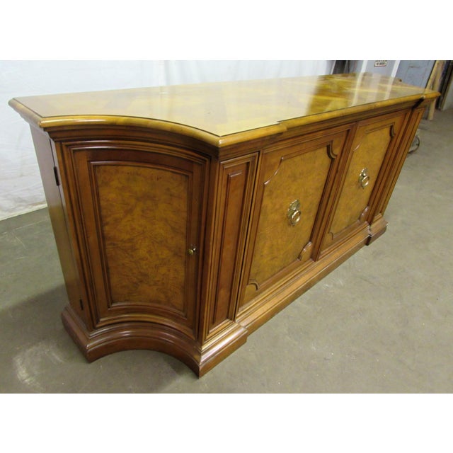 Large wood sideboard with parquet top and burled wood insets on the cabinet doors. Canted corner cabinets on both sides....