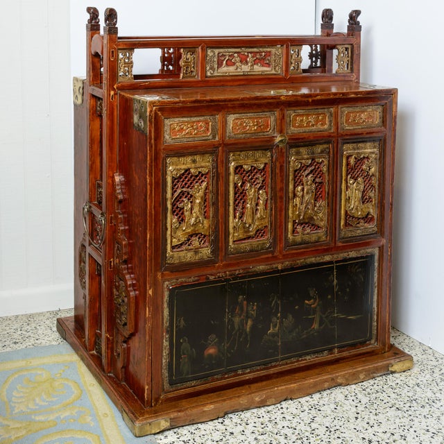 Chinese travel case. Shelf Storage behind door panel that has a lock. Carved and painted details. Large handle and entire...