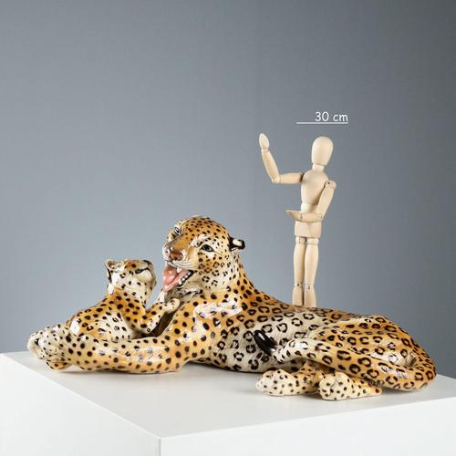 Hand-painted polychrome ceramic sculpture depicting a leopard with cub. Ronzan Manufacture, under the manufacturer's...