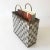 This mid-century, modern, Hollywood Regency-style magazine rack or stand was designed in the style of Paul Evans. It is...